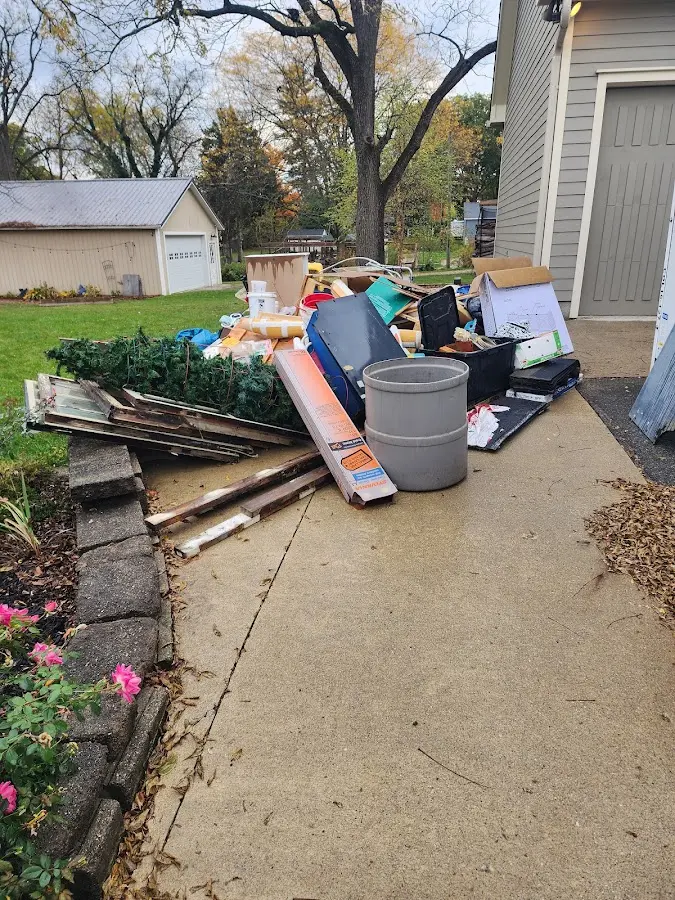 Dumpster being loaded with debris for Residential Dumpster Rental in Langley Park